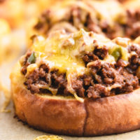 Close up of melted cheese on top of texas toast sloppy joes.