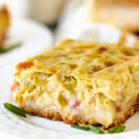 Close up view of a slice of breakfast casserole.