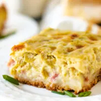 Close up view of a slice of breakfast casserole.