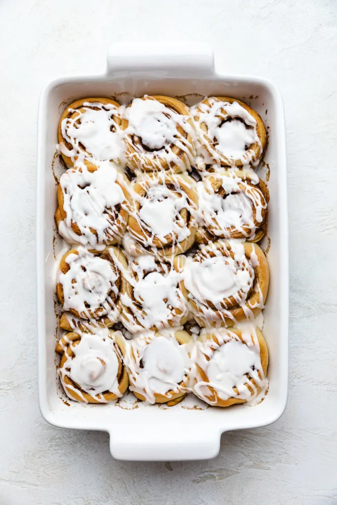 Top down view of iced cinnamon rolls.