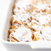 Side view of sweet buns in a baking dish.