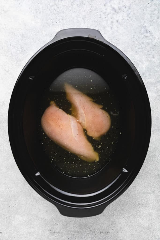 Chicken breasts in broth.