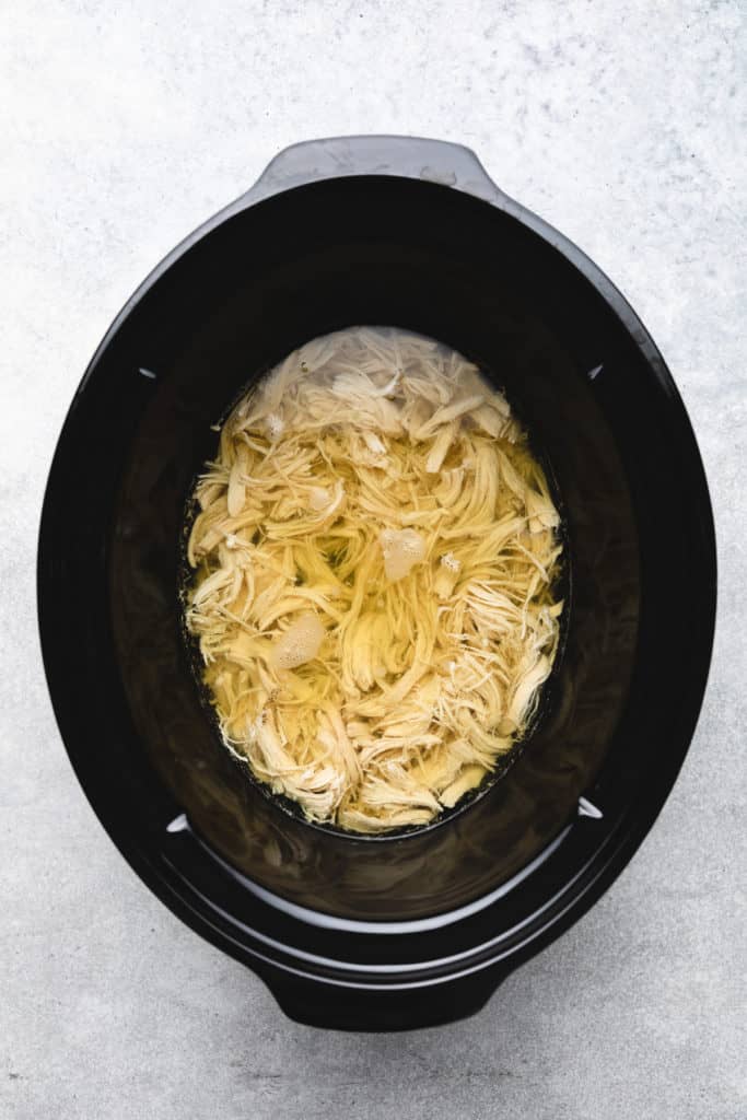 Shredded chicken in a broth.