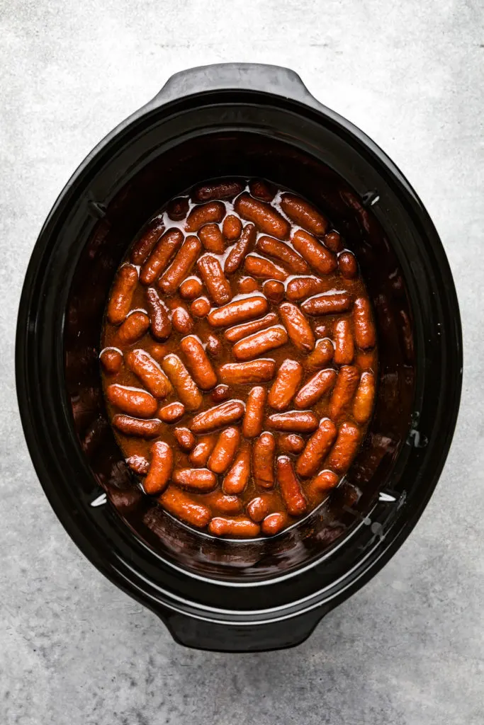 Grape jelly cocktail weiners in slow cooker.