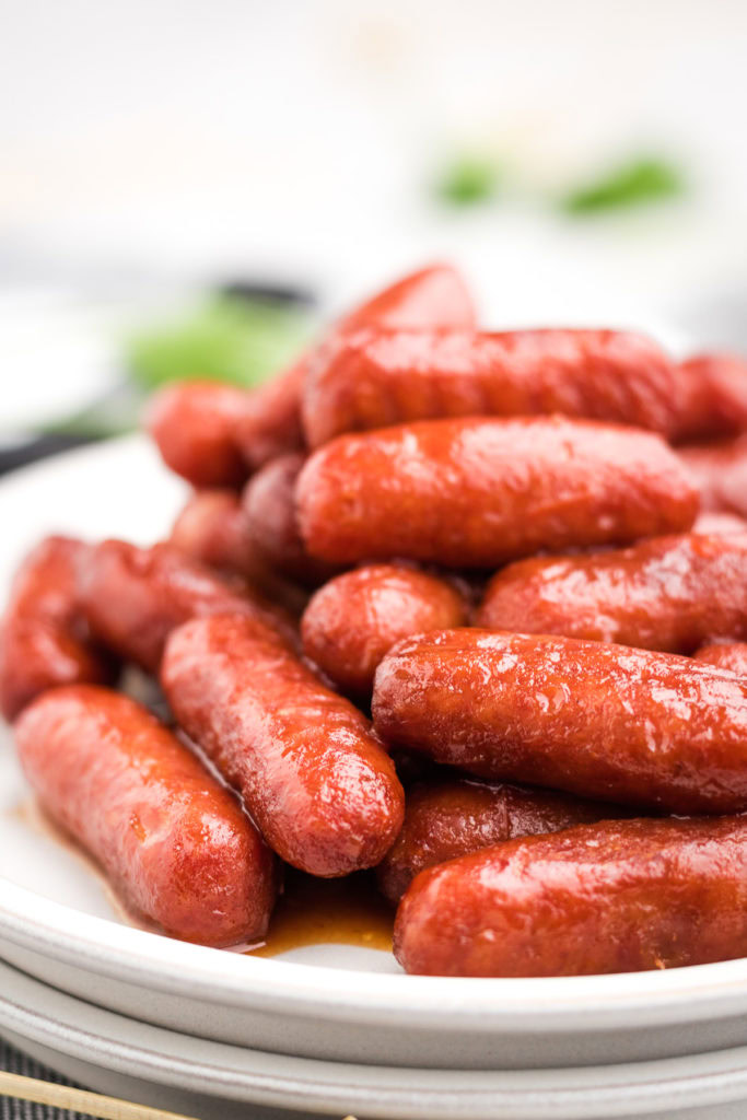 Slow cooker little smokies on plates.