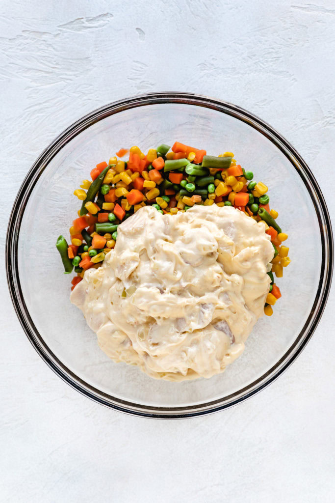 Blanched vegetables and soup mix in a large bowl.