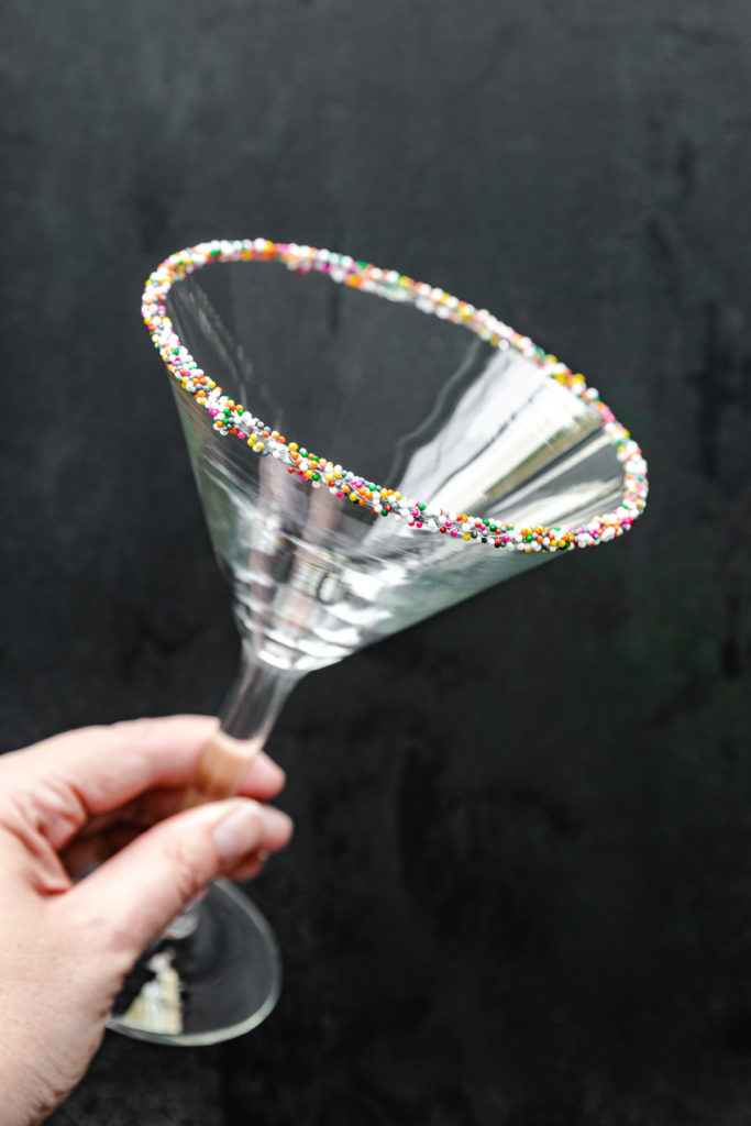 Martini glasses rimmed with sprinkles.