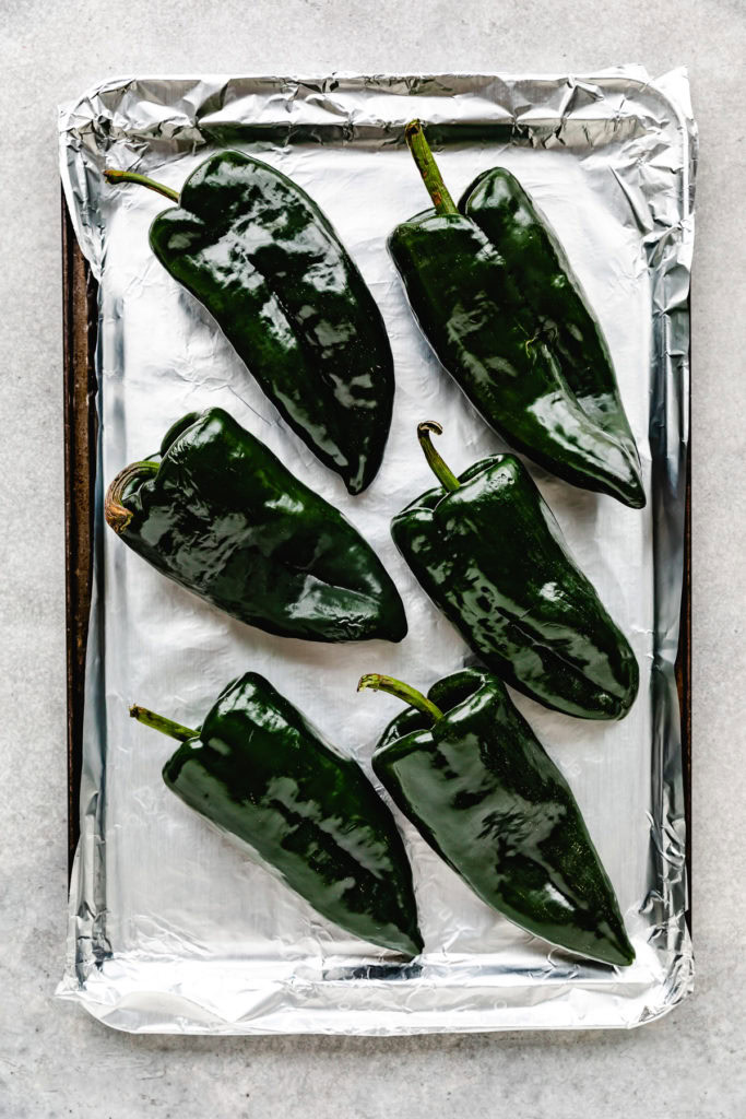 Poblanos on a sheet pan.