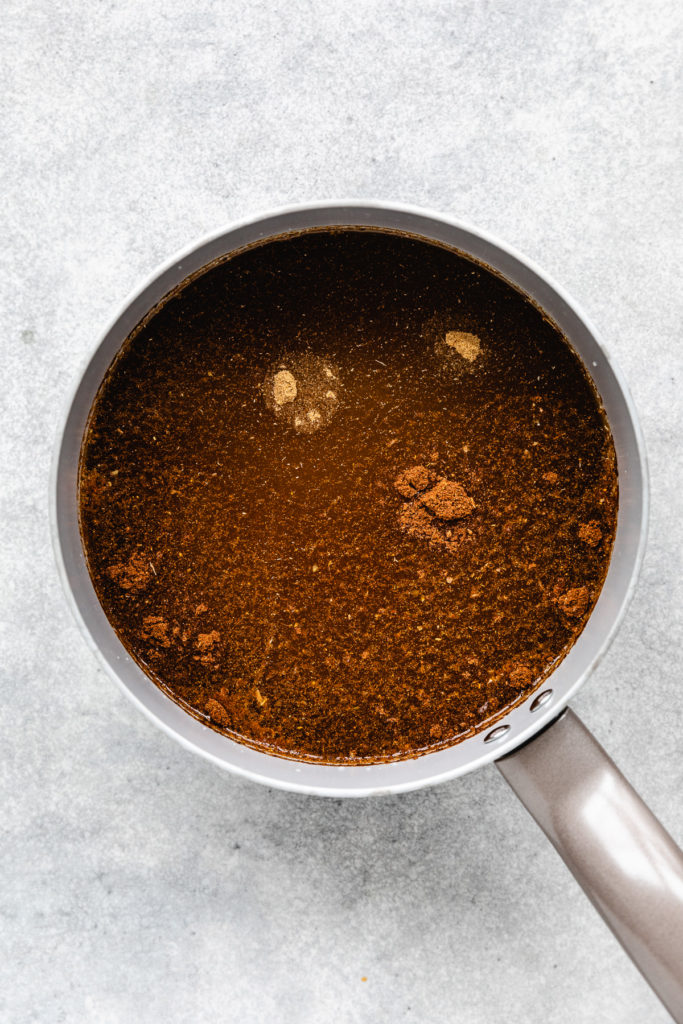 Seasonings in a pan of oil and broth.