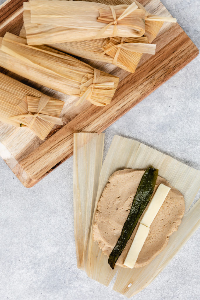 Masa, cheese, and chiles in a corn husk.