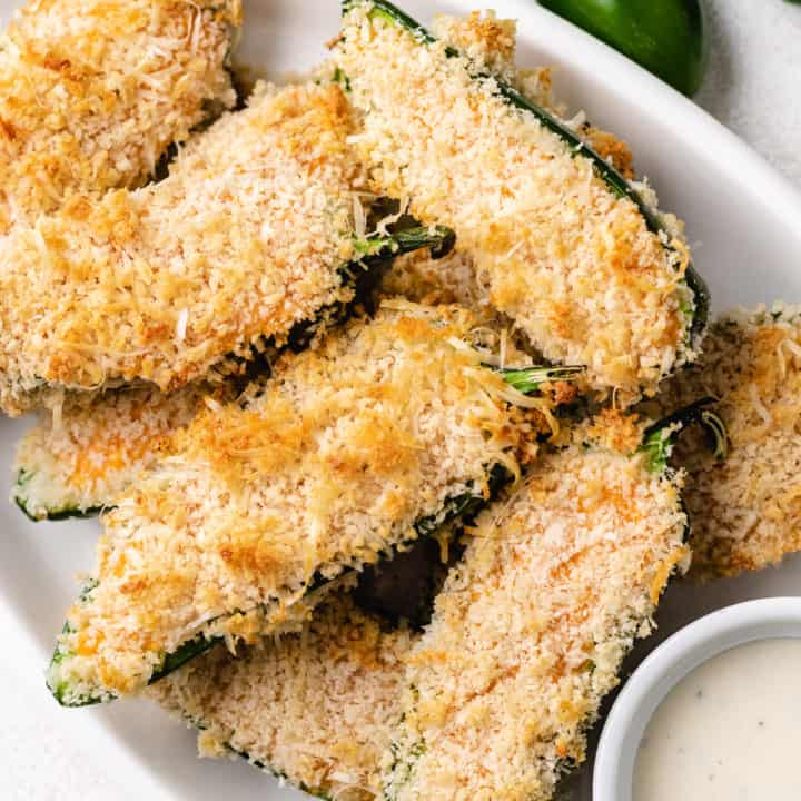 Close up view of jalapeño poppers on a plate.