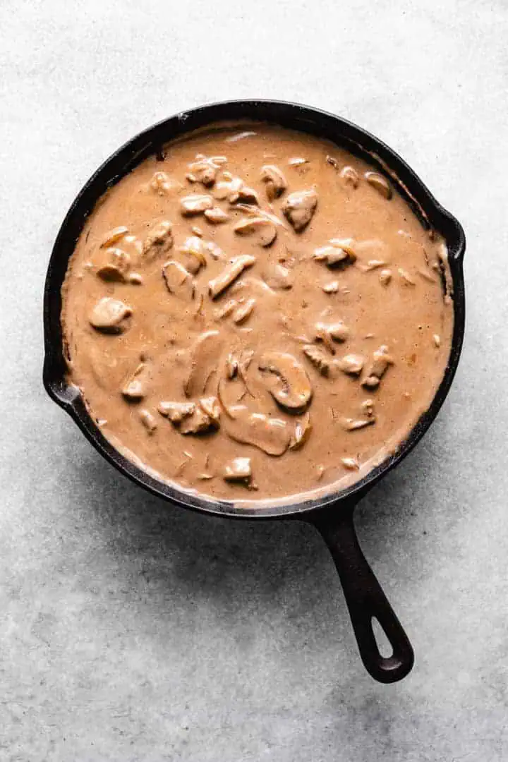 Savory mushroom sauce in a pan.