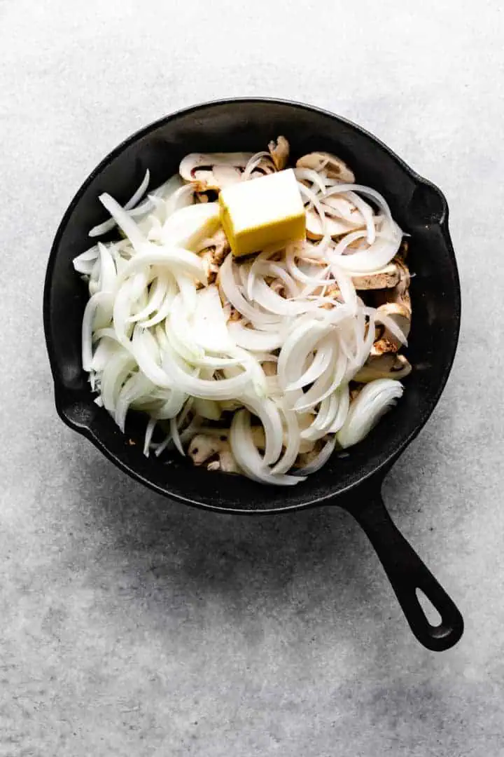 Butter on to of mushrooms and onions.