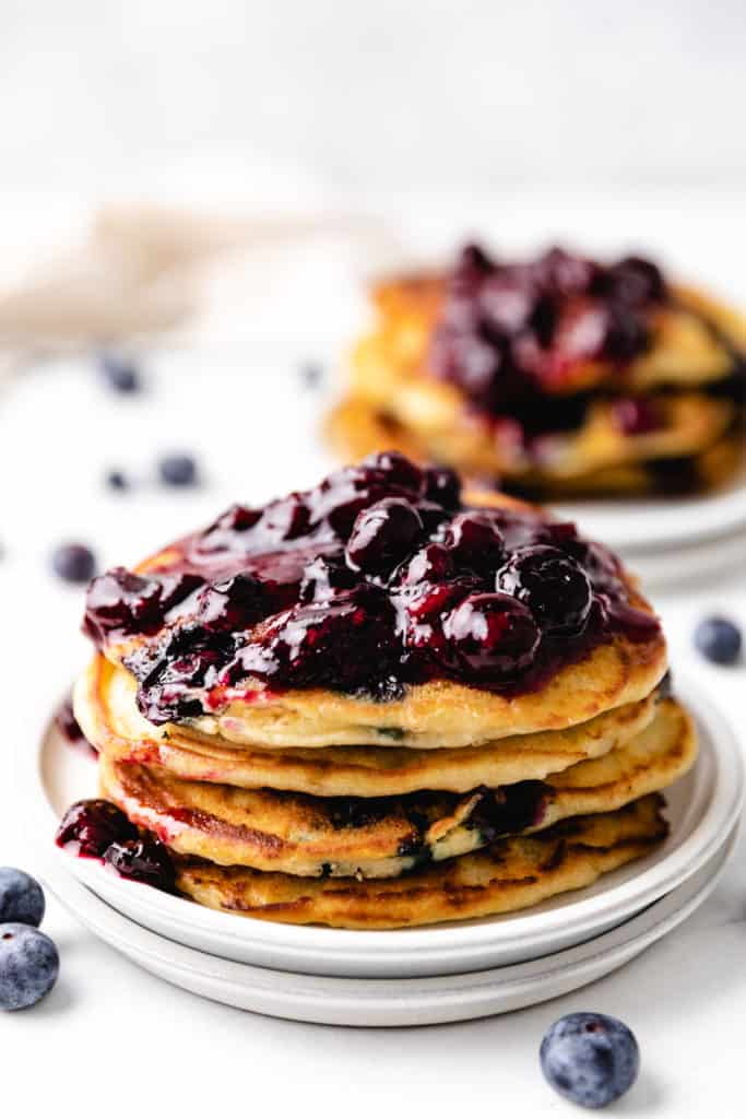 Blueberry pancakes topped with blueberry compote.