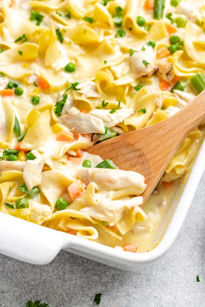 Creamy Chicken Noodle Casserole Close up view of chicken casserole in a baking dish.