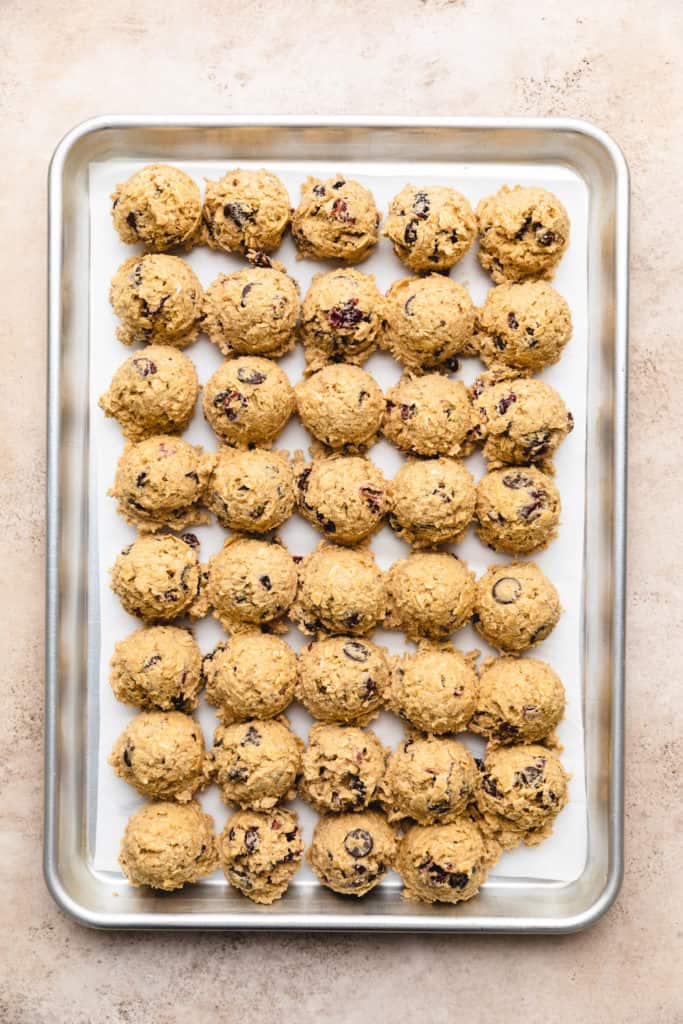 Chilled dough balls on a baking sheet.