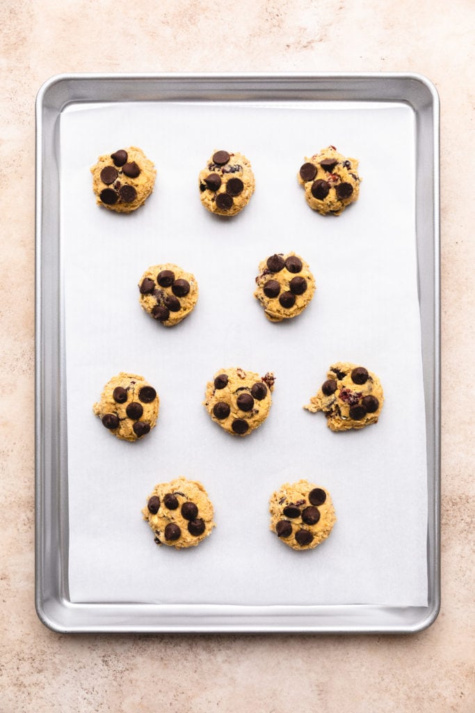 Raw cookie dough on a cookie sheet.