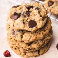 Close up view of cranberry oat cookies in a stack.