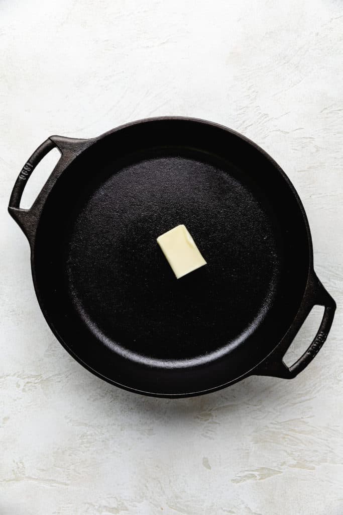 Top down view of butter in cast iron.