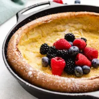 Close up view of a Dutch baby in a pan.