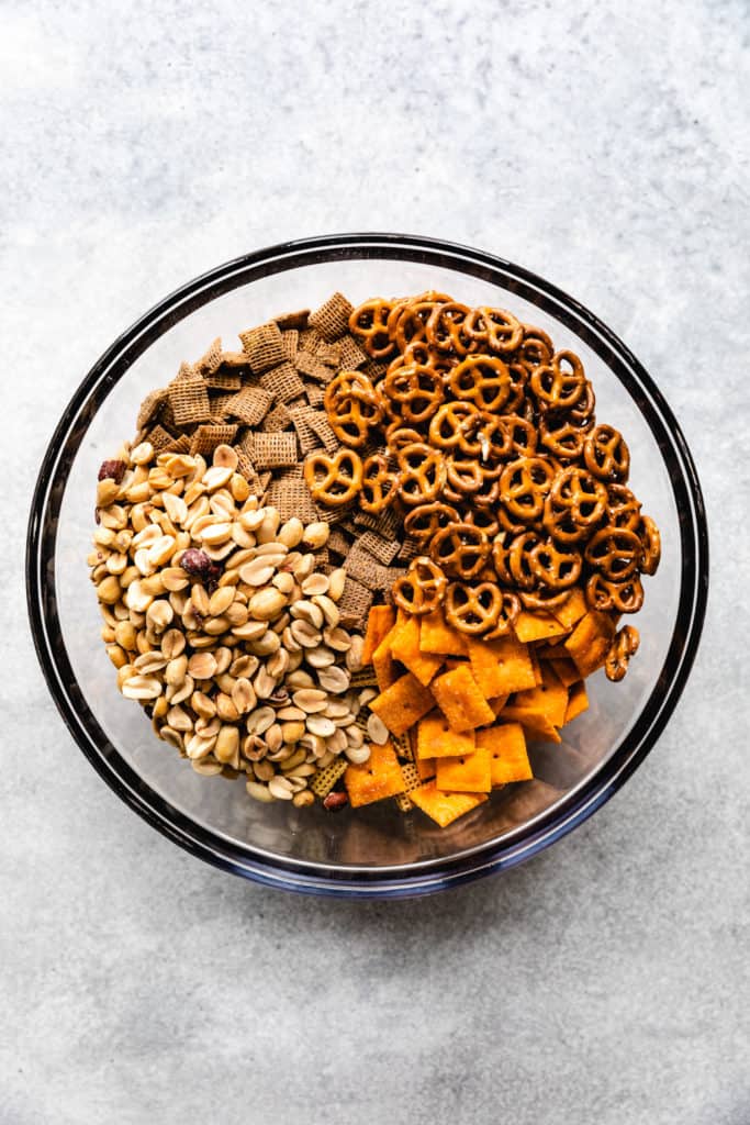 Ingredients for chex mix in a bowl.