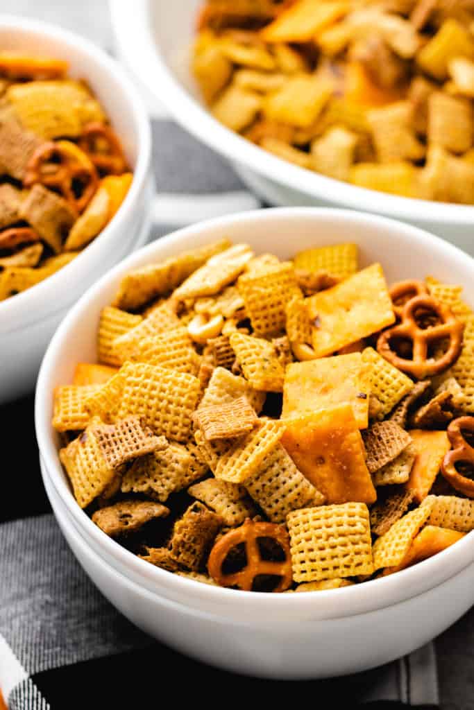 Firecracker chex mix in a white bowl.