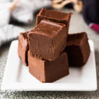 Stack of bailey's irish cream fudge on a white plate.