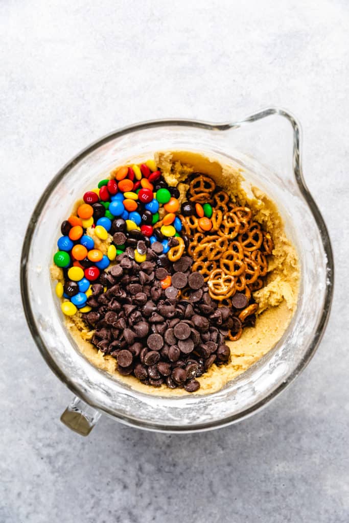 M&ms, pretzels and cookie dough on top of cookie dough.