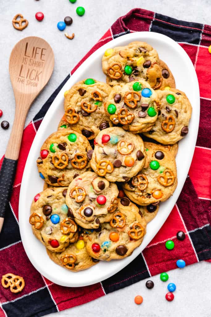 Batch of chocolate chip cookies with M&Ms and pretzels.
