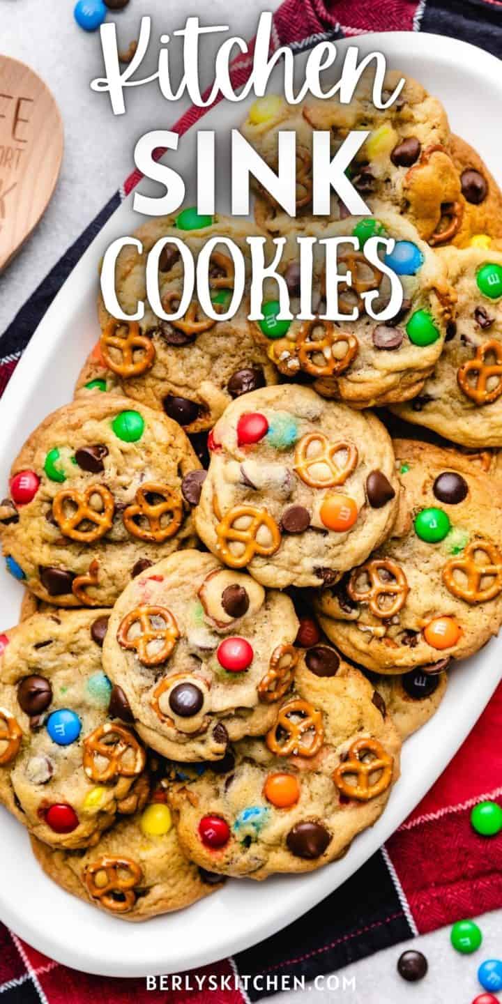 Close up view of a batch of kitchen sink cookies next to a spatula.