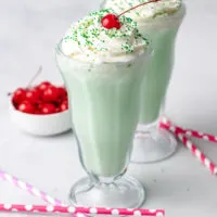 Close up view of two glasses filled with a copycat Shamrock Shake.