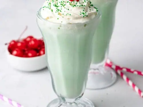 Close up view of two glasses filled with a copycat shamrock shake.