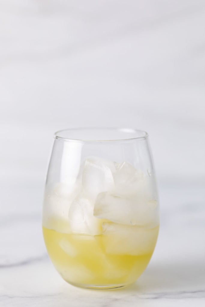 Coconut rum and pineapple juice in a glass.