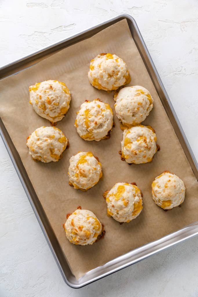 Baked biscuits on a baking sheet.