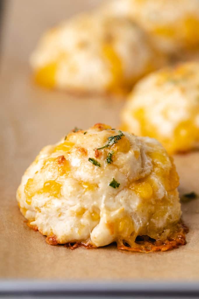 Cheese biscuits with melted garlic butter.