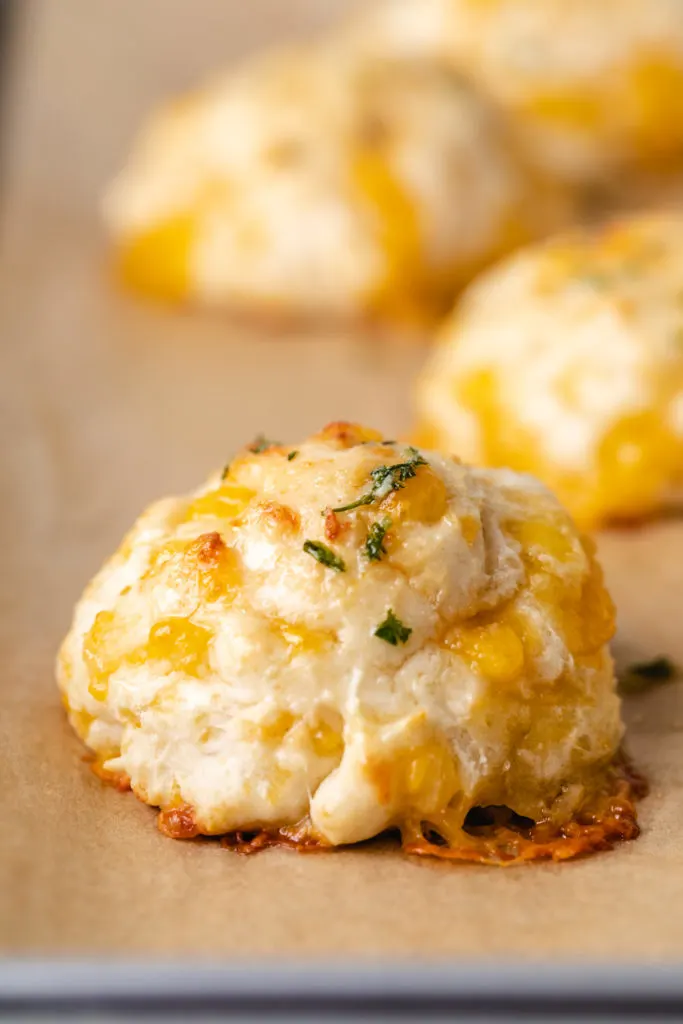 Cheese biscuits with melted garlic butter.