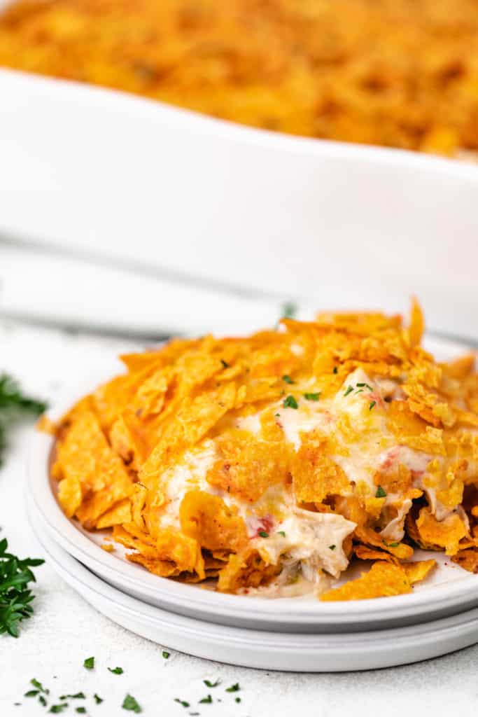 Close up view of chicken casserole topped with crushed nacho chips.