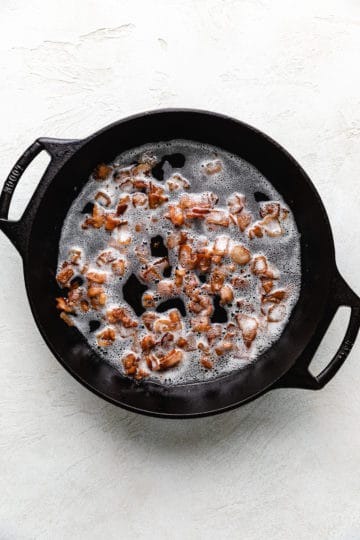 Bacon frying in a pan.