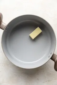 Butter in a pan.