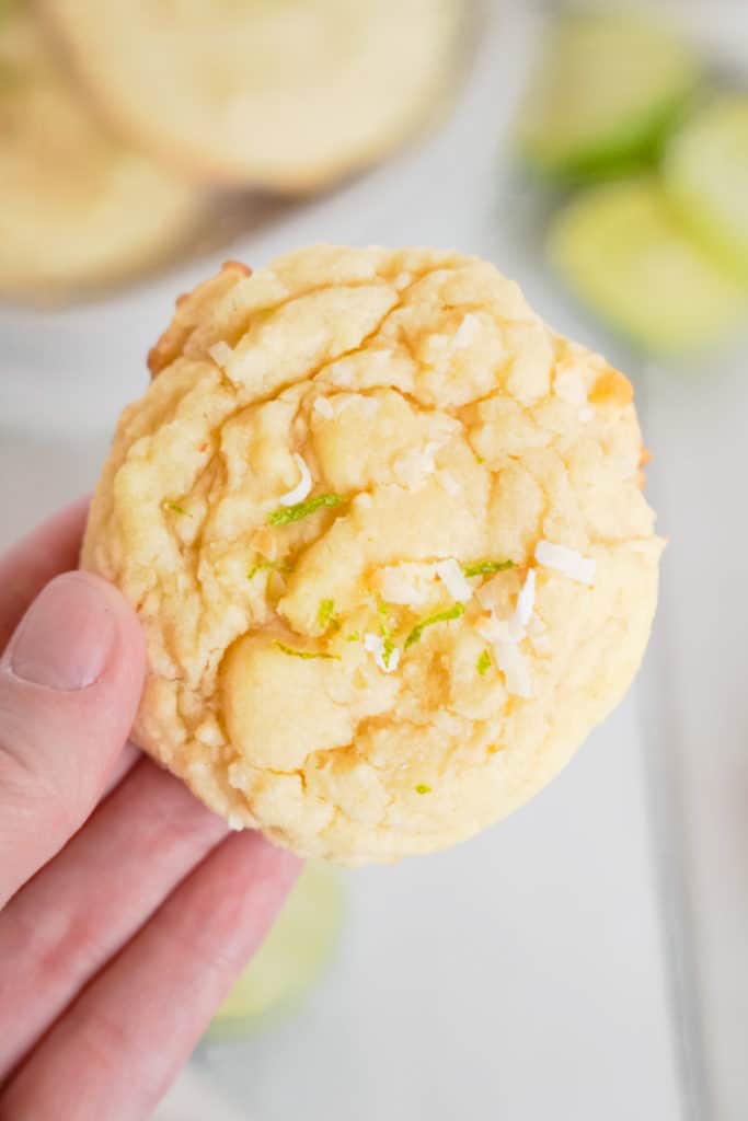 Hand holding a key lime cookie.