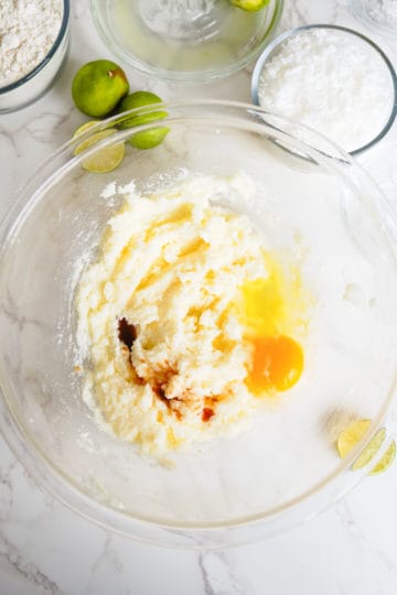 Egg and vanilla added to creamed butter and sugar.