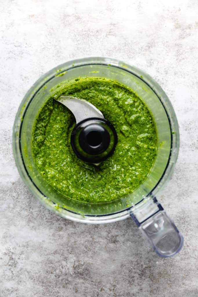 Basil pesto sauce in a food processor.