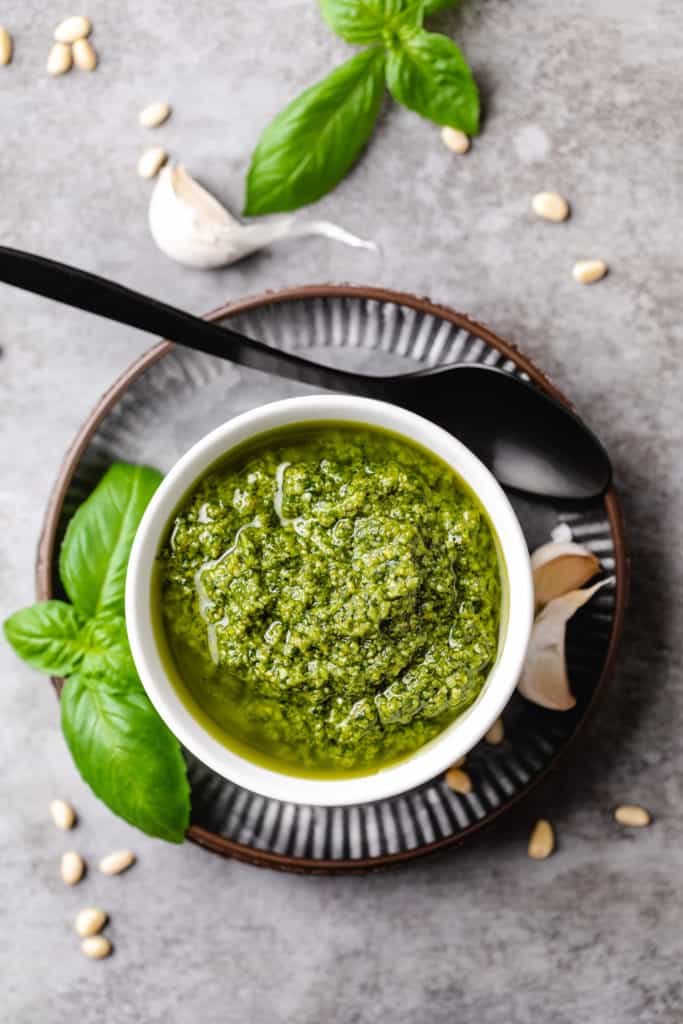 Top down view of pesto in a small dish.