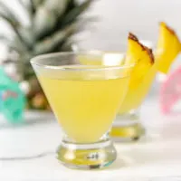Side view of a pineapple coconut martini.