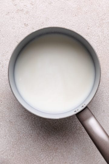 Milk, water, brown sugar and vanilla in a pan.