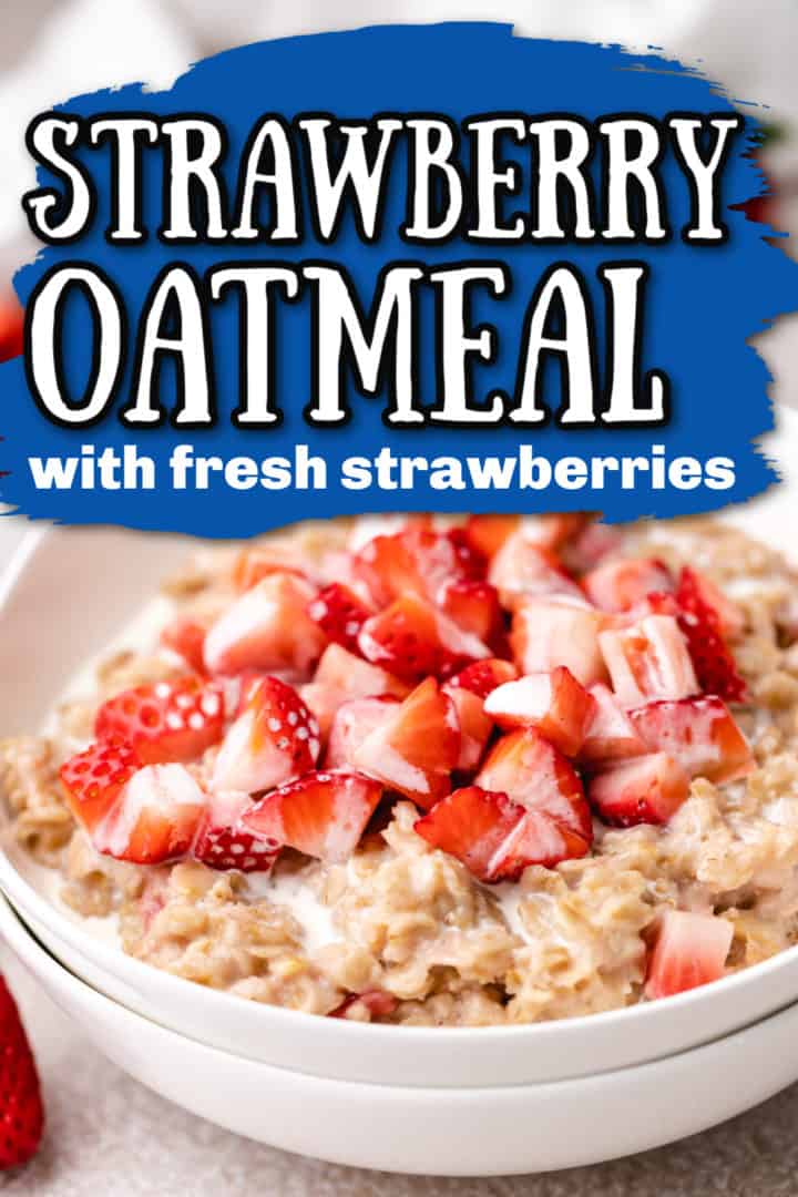 Close up view of a bowl of strawberries on top of oatmeal.