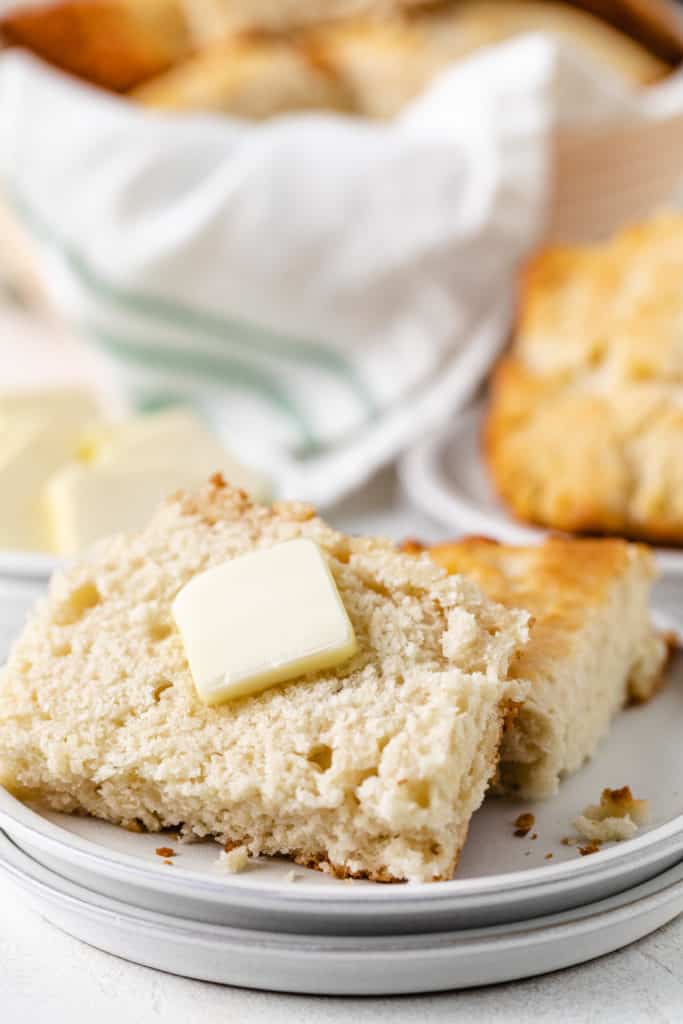 close up view of a biscuit with butter.