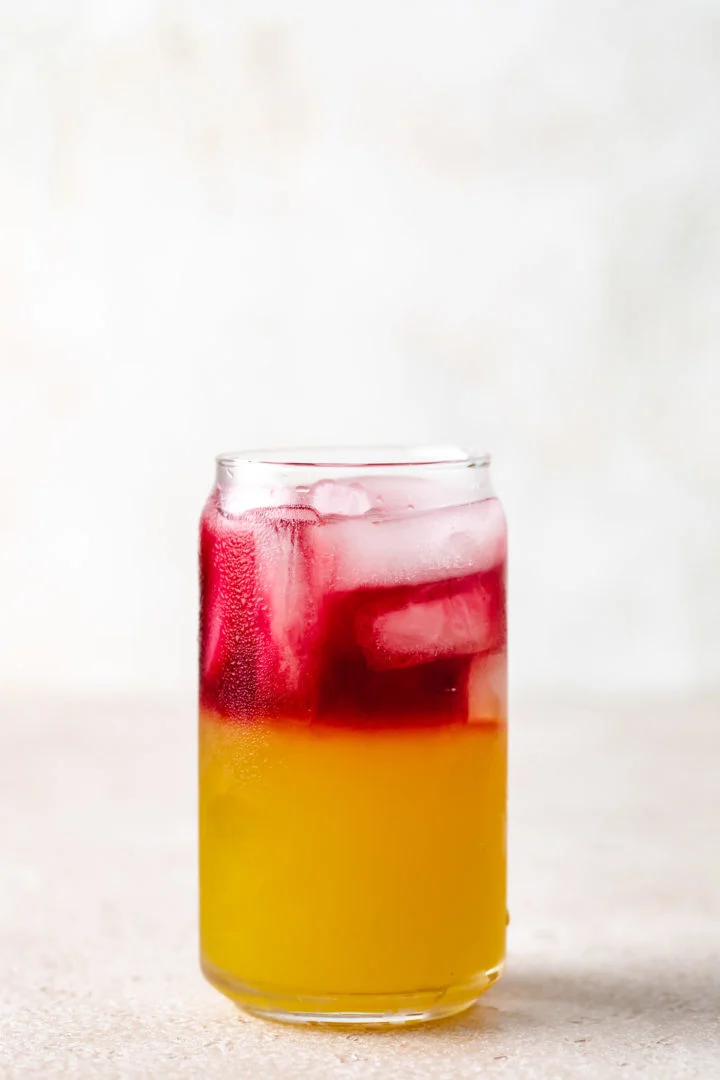 Cranberry juice on top of pineapple juice and coconut rum.