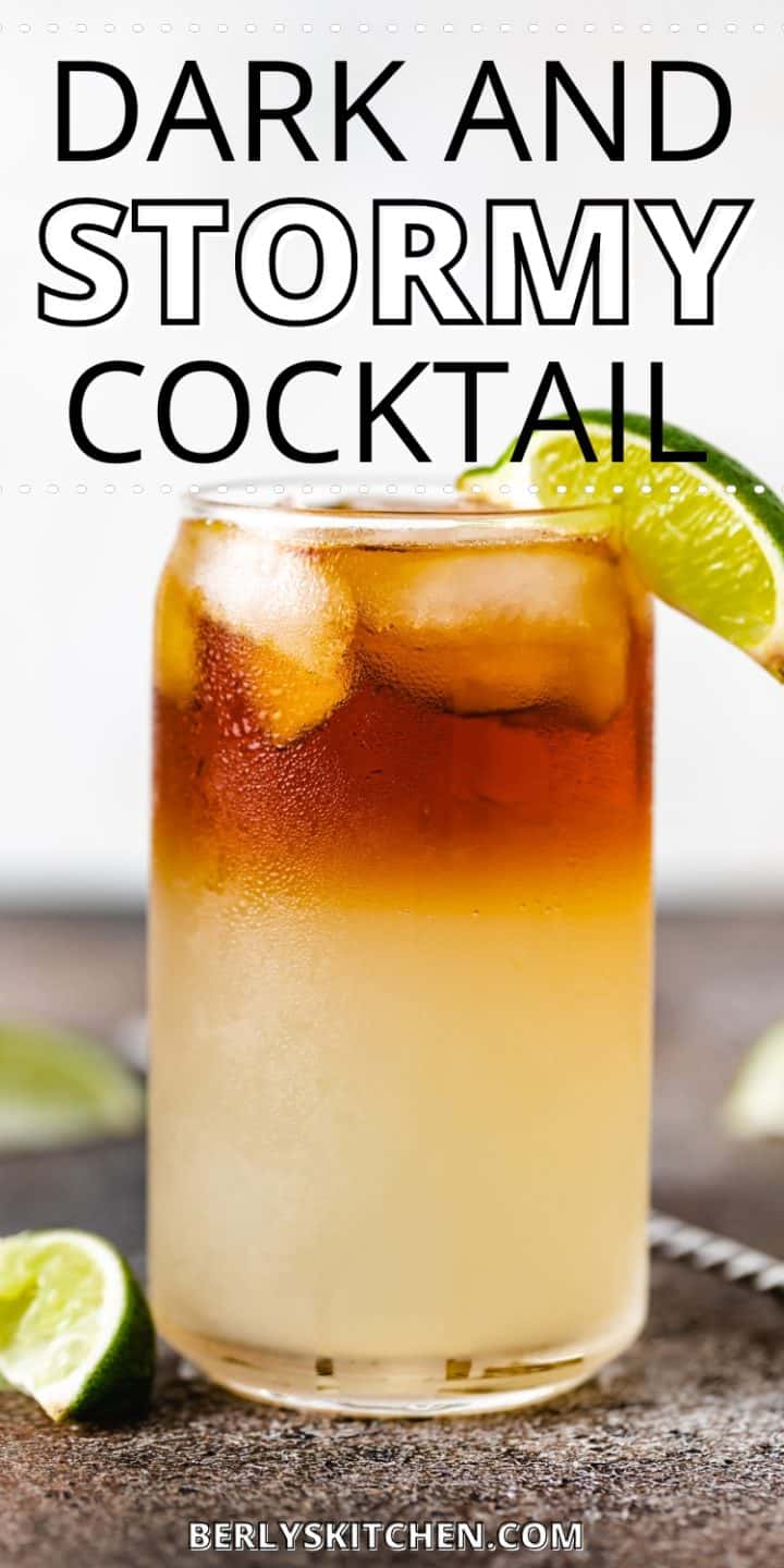 Side view of a ginger beer and rum drink with a lime.