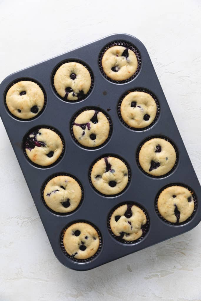 Gluten free lemon blueberry muffins in a pan.